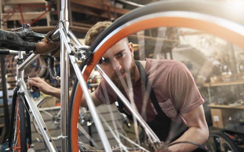 Bike mechanic inspecting bike